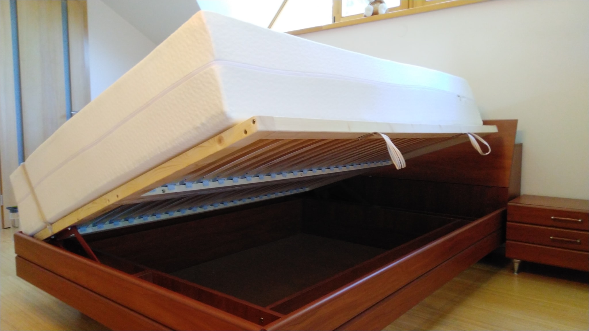 Matrest lift-up bed base with custom slats and personalized mattress